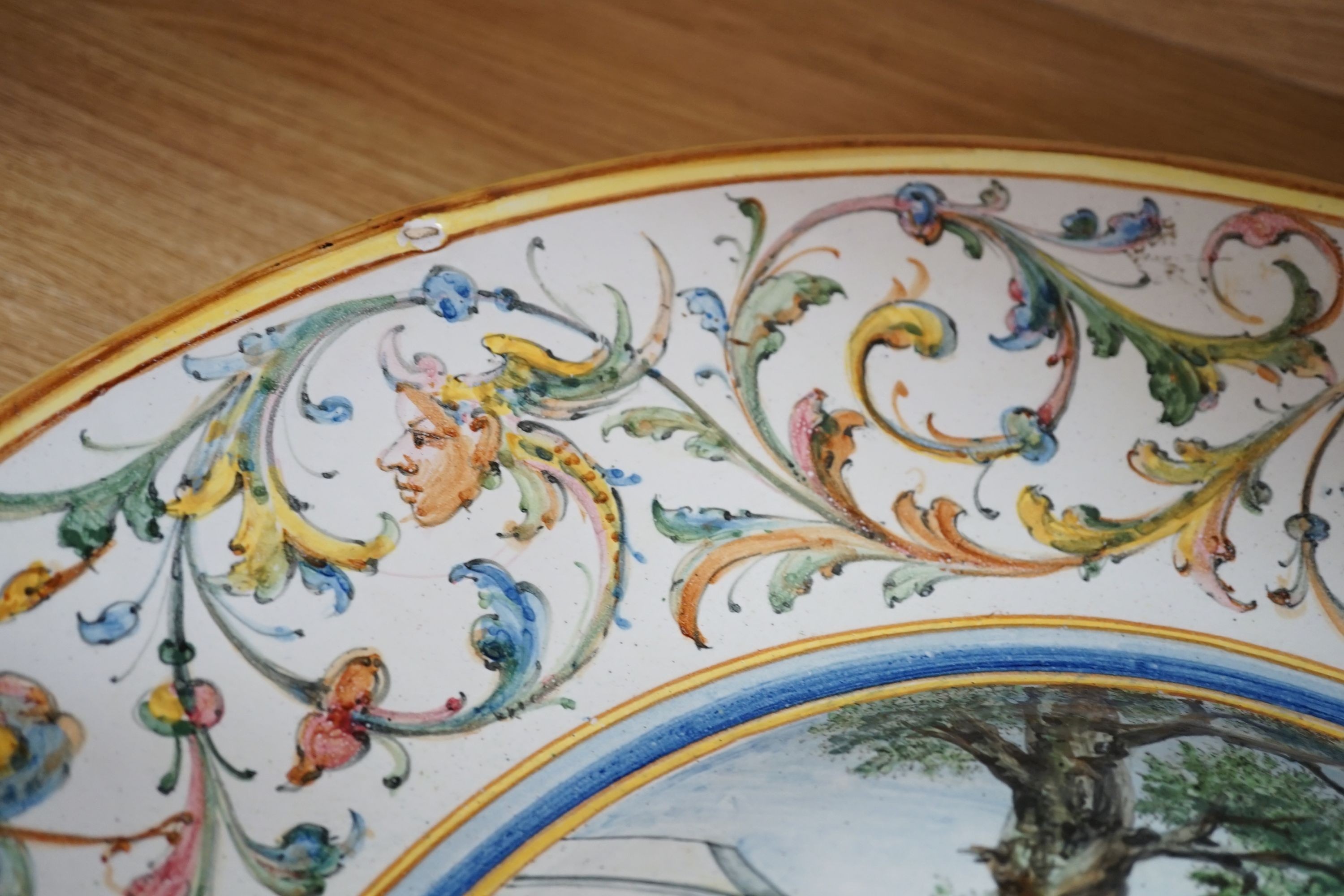 A 19th century large Italian majolica charger, AVF mark, 55cm high.